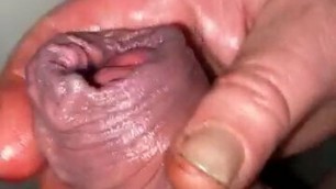 Oiled foreskin with big cockhead cumshot